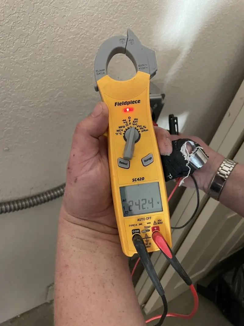 Voltage testing with clamp meter during Generator Installation in Acme